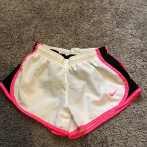 White, pink and black nike shorts